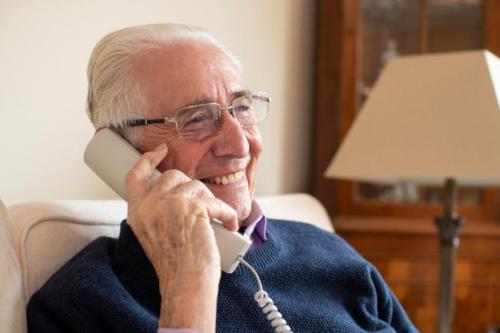 older-man-using-home-phone